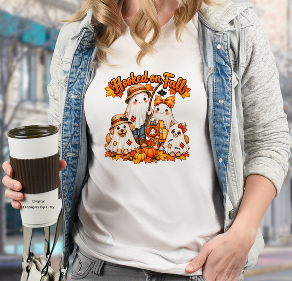 White T-shirt featuring Hooked on Fall lettering above two ghost children, a ghost dog and cat, pumpkins, and autumn leaves.